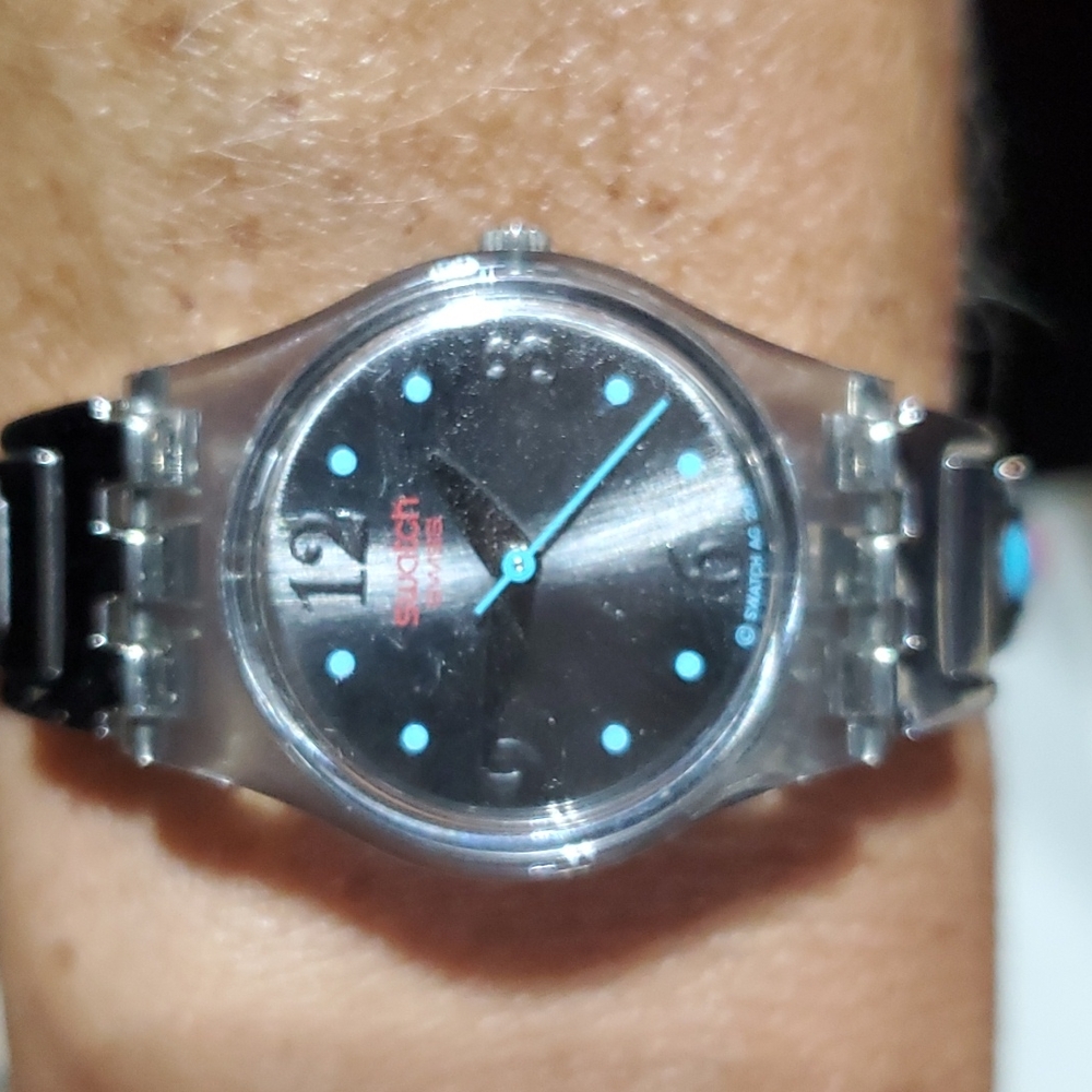 Swatch stretch silver tone watch.